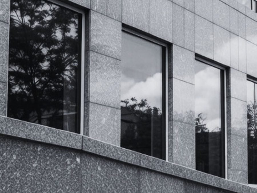 Cast stone coping and trim on a building exterior